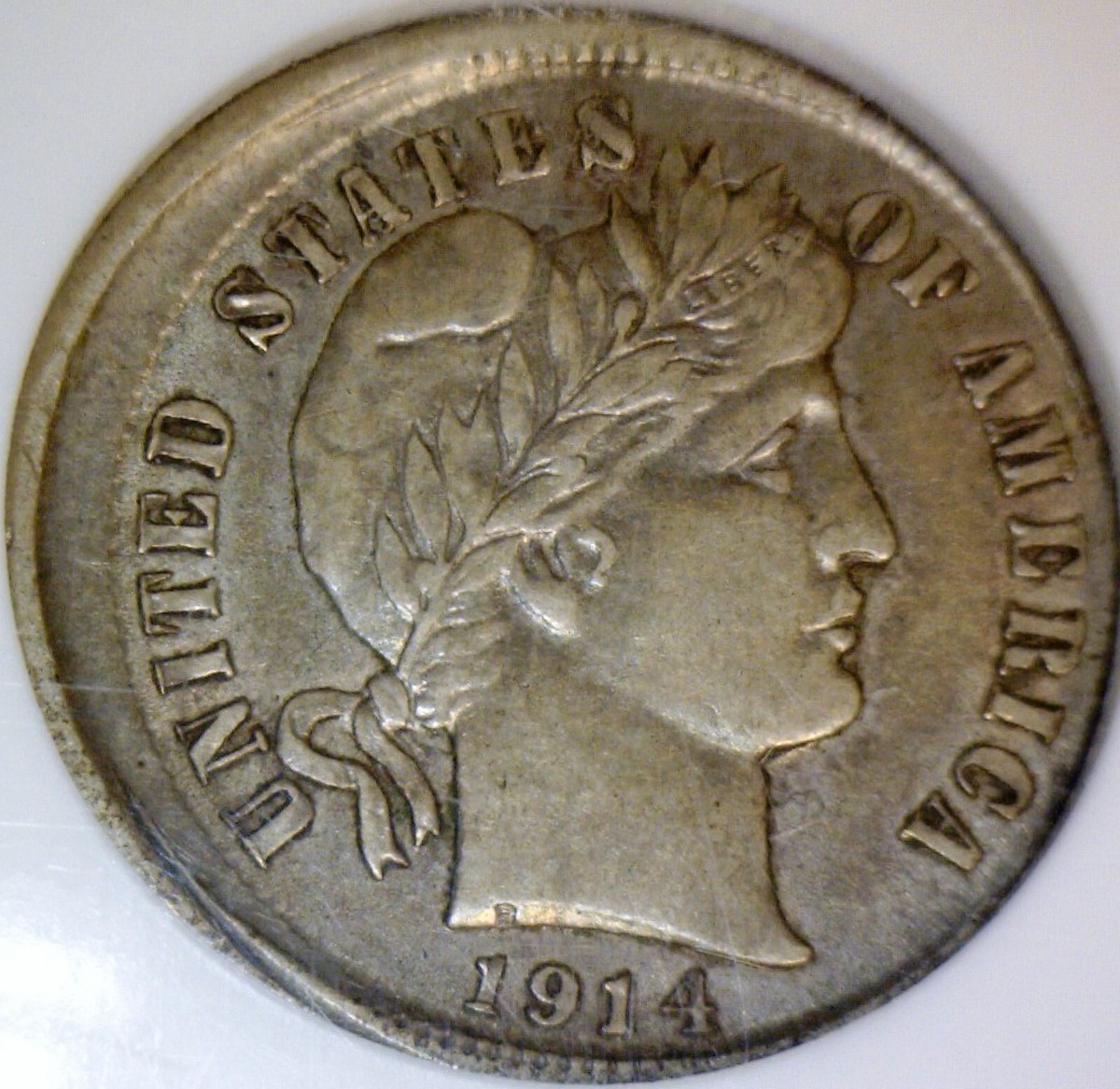 1914 Barber Dime off-center strike error showing crescent blank area and shifted Liberty portrait